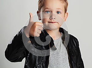 Fashionable child in leather coat.little boy hairstyle