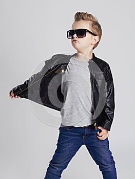 Fashionable child in leather coat.little boy in sunglasses