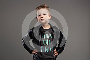 Fashionable child in leather coat.stylish little boy