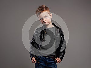 Fashionable child in leather coat.stylish little boy