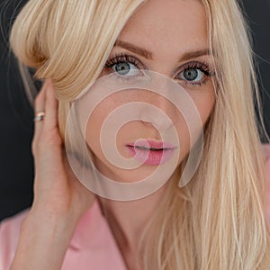 Fashionable close-up portrait of a beautiful young woman model