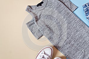 Fashionable concept. Women`s urban style. Gray dress and white s