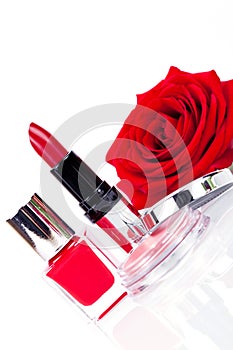 Fashionable cosmetics with a fresh red rose