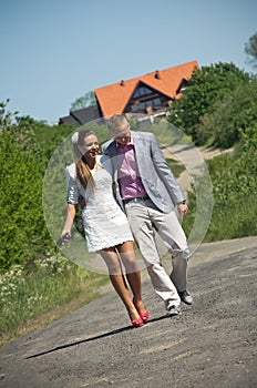 Fashionable couple in country