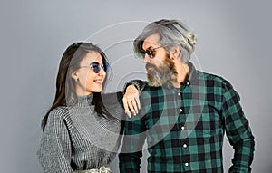 Fashionable couple posing. Enjoying spring time together. Street style. Today is a good day. Hipster couple. Bearded man