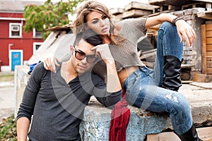 fashionable couple wearing jeans posing dramatic