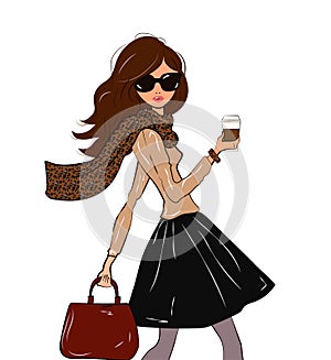 Fashionable cute girl in cravat with leopard print and black midi skirt with a coffee in her hand walking down the