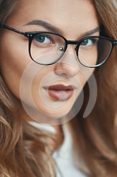 Fashionable eyewear model close-up portrait wearing transparent