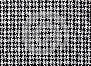 Fashionable fabric made of wool with pepita pattern in black and off-white