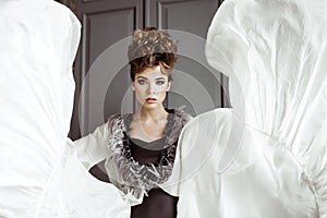 Fashionable female portrait of cute lady in dress indoors