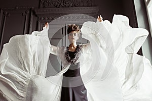 Fashionable female portrait of cute lady in dress indoors