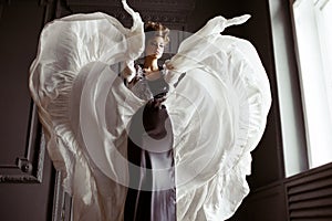 Fashionable female portrait of cute lady in dress indoors