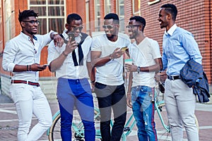 Fashionable friends at a meeting. a group of five handsome African American men well-dressed businessmen having fun and