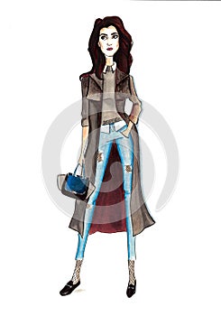 Fashionable girl in blue jeans with a bag