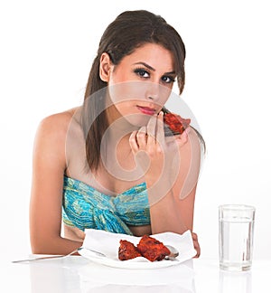 Fashionable girl eating non-vegetarian