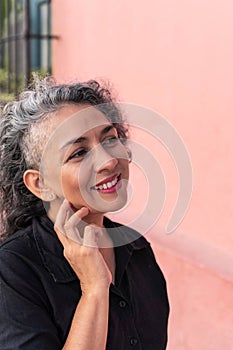 Fashionable girl with gray hair posing outside