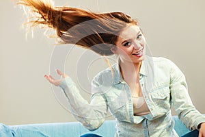 Fashionable girl with long hair blowing