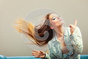 Fashionable girl with long hair blowing