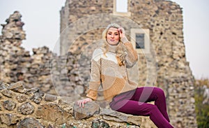 Fashionable girl tourist. Vacation and travel. Travel agency. Travel destinations. Woman makeup face sit on stony ruins