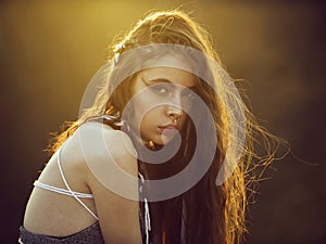 Fashionable girl. woman with long indie hairstyle, has white rope in hair,
