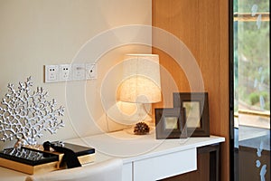 Fashionable glass lamp on desk photo