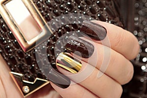 Fashionable gold and brown nail design