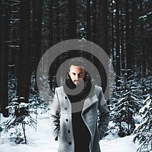 Fashionable handsome man in winter coat photo