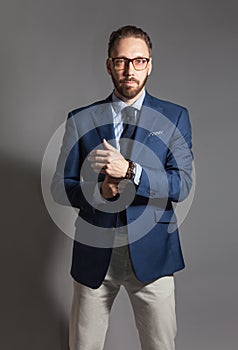 Fashionable handsome stylish bearded man with glasses