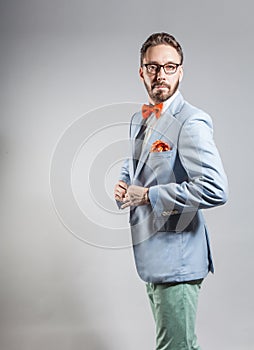 Fashionable handsome stylish bearded man in light blue blazer