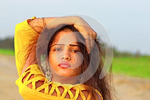 A fashionable Indian model girl in yellow top