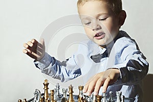 Fashionable Little boy playing chess.Smart kid.fashion children
