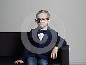 Fashionable little boy in suit and glasses.stylish child