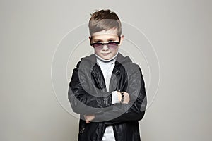 Fashionable little boy in sunglasses. stylish kid