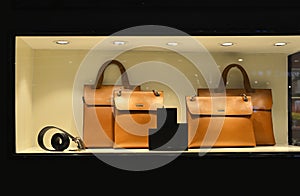 fashionable Luxury leather handbag Belt Wallet in shop window lit up by led light ,handbag store,shopping,clothing shop