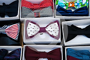 Fashionable male bowties in paper boxes