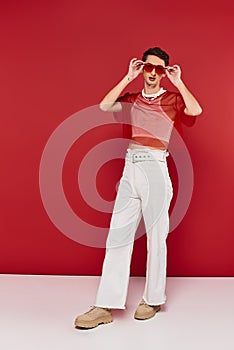 fashionable modish androgynous man with red