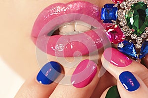 Fashionable multi-colored manicure short nails and makeup