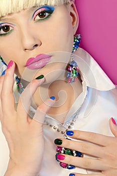 Fashionable multi-colored manicure short nails and makeup