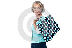 Fashionable old lady with shopping bag