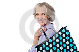 Fashionable old lady with shopping bag