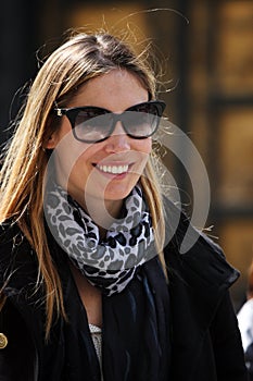 Fashionable and optimistic woman with sunglasses