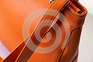 Fashionable orange women\'s handbag on white background