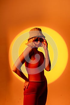 Fashionable portrait of blonde lady in sunglasses posing.