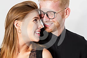 Fashionable red hair couple, Young beautiful couple in Black clothes, Portrait of a woman and man, Close up of a couple hugging