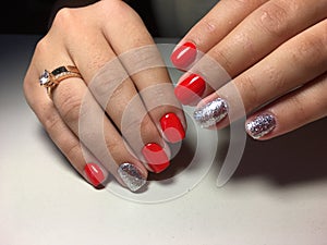 fashionable red manicure with gold design