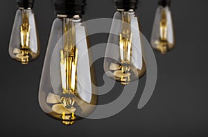 Fashionable retro vintage style of light bulb on black background ,LED bulb in vintage shape , Energy saving concept