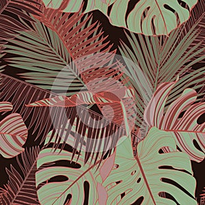 Fashionable seamless tropical pattern with green brown tropical  palms leaves on a black background.