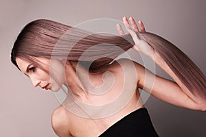 Fashionable shot of a woman with purple blonde hair.