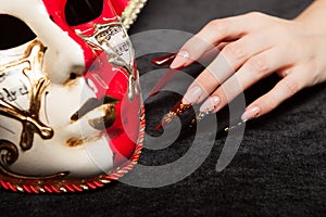 Fashionable stilettos nails design with Venetian buffoon mask