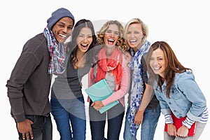 Fashionable students in a row smiling